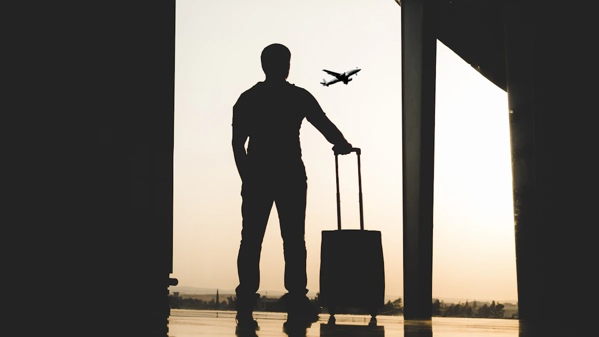 Traveler with a suitcase looking at a departing airplane