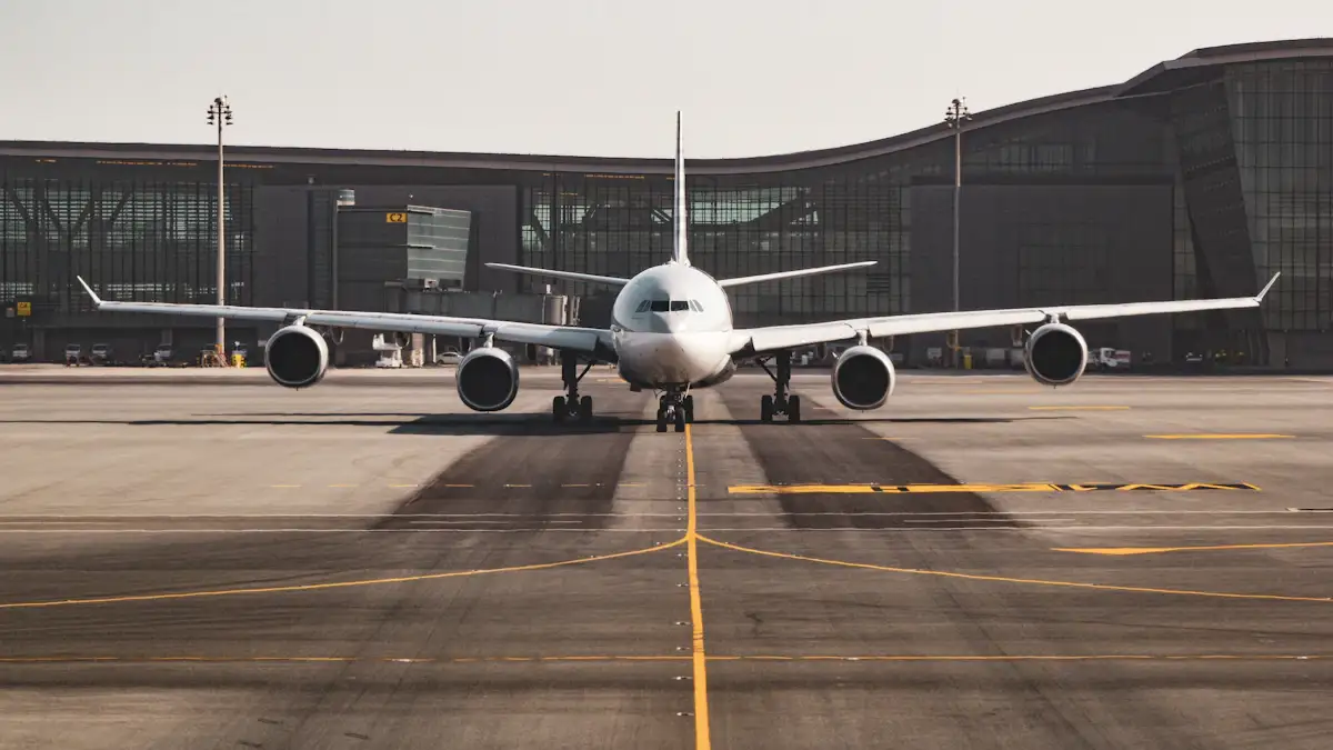 Airplane waiting at an airport terminal on a cloudy day