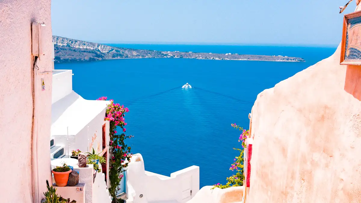 White Santorini buildings overlooking the blue Aegean Sea