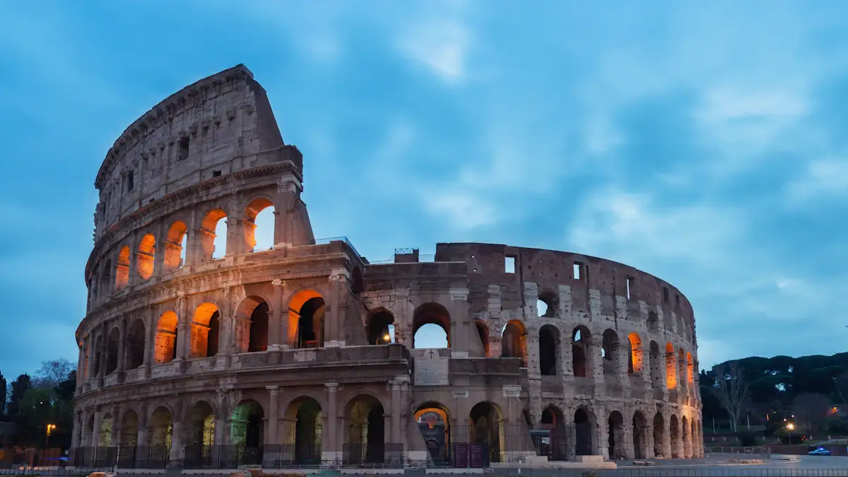 The Colosseum in Rome under a blue sky